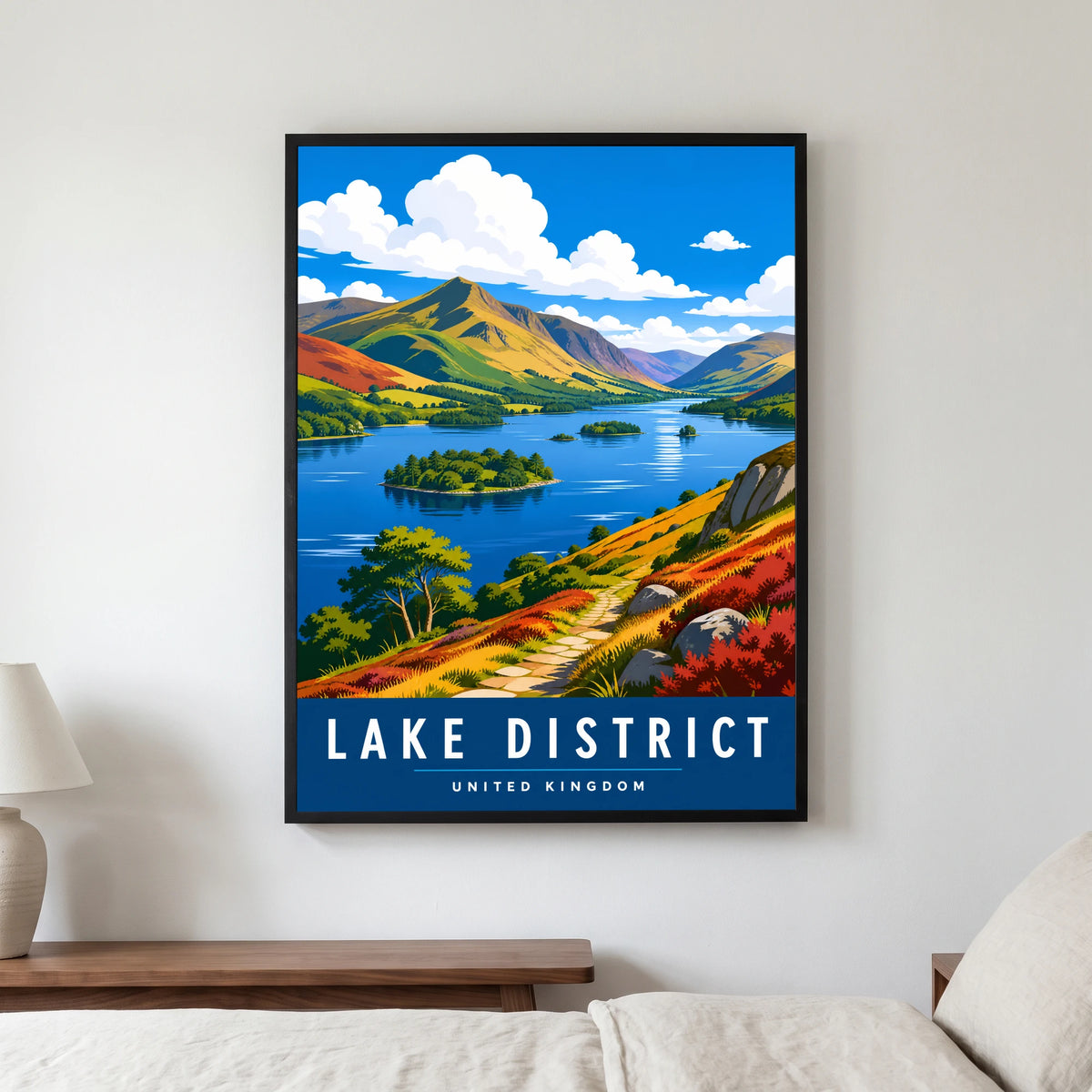 Derwentwater travel poster in a black frame, hanging in a bedroom3