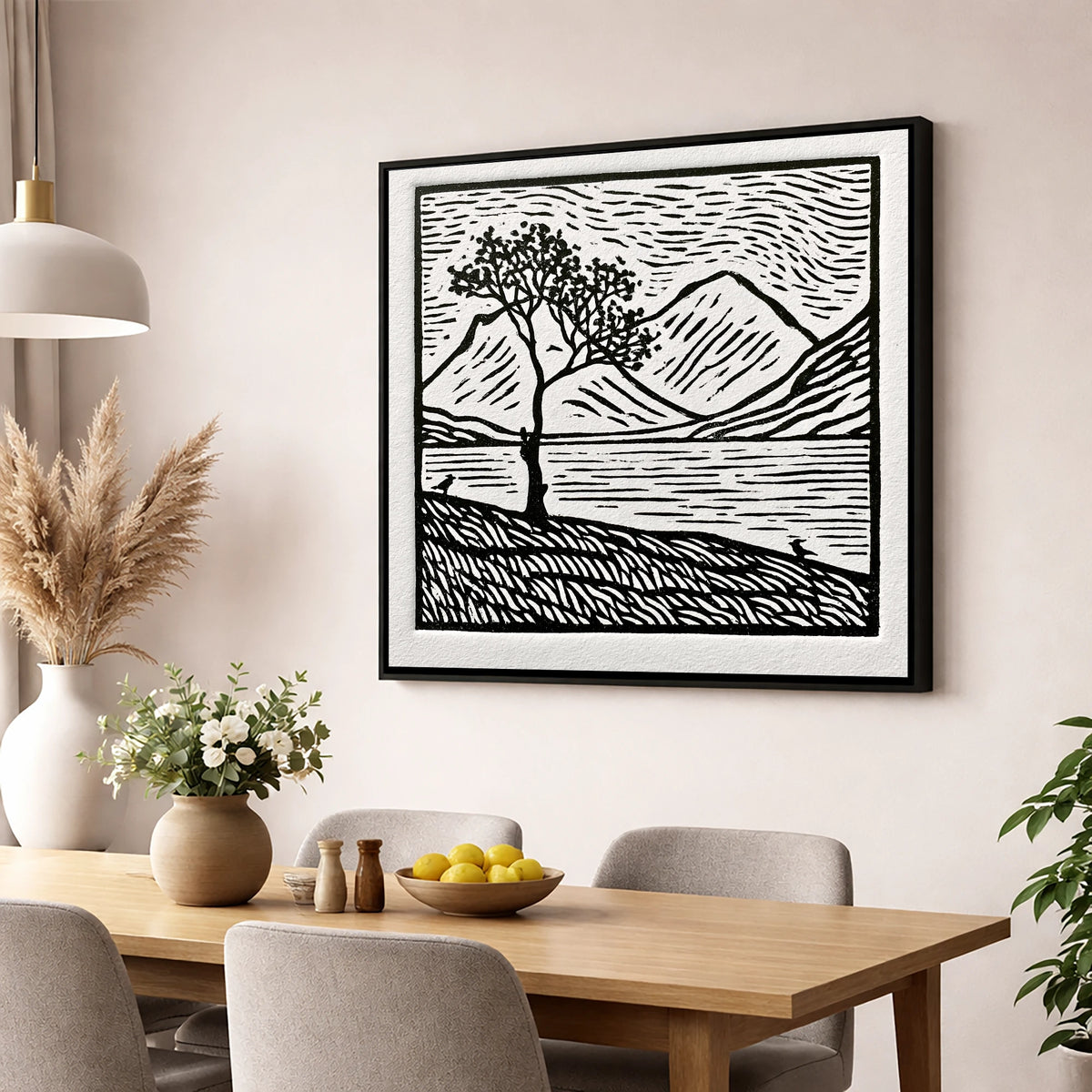 Monochrome Buttermere and Lone Tree lake district lake wall art displayed in a dining room