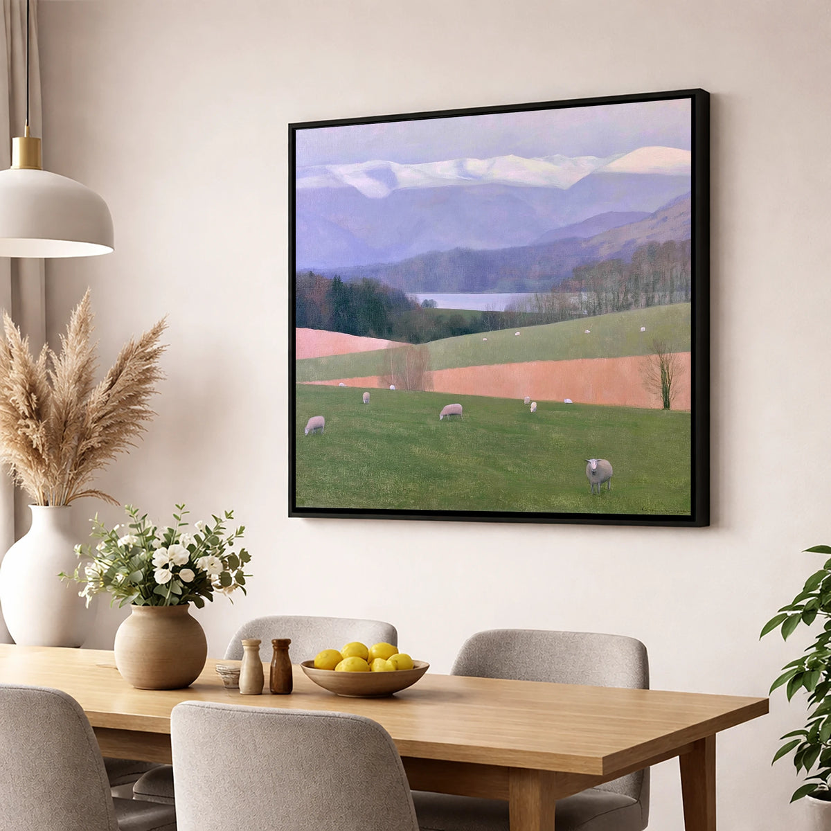 Hawkshead Pastures and Snowy Fells lake district village wall art displayed in a dining room