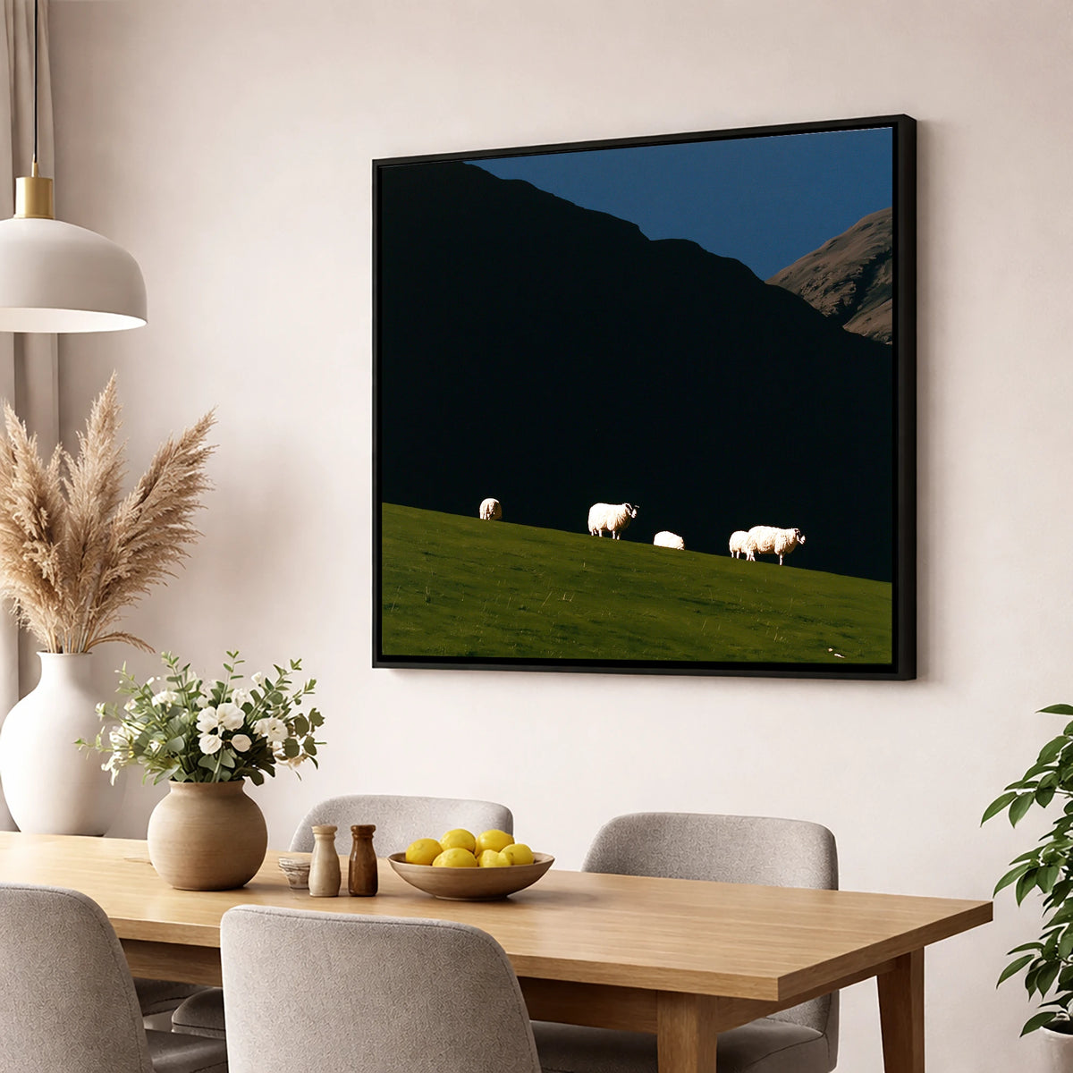 Sunlit Herdwicks on Dark Fellside lake district wildlife wall art displayed in a dining room
