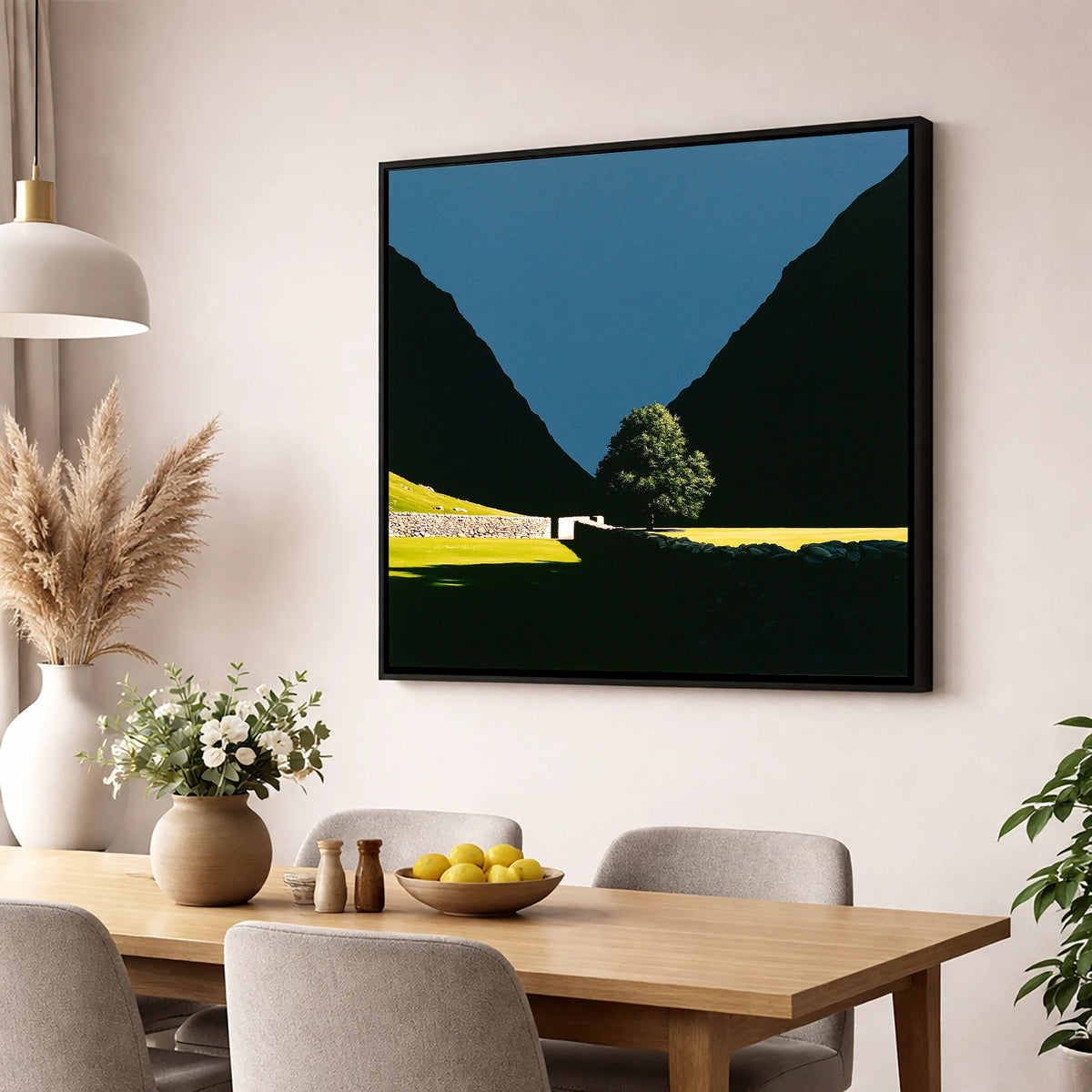 Sunlit Tree Between Silhouetted Fells lake district valley wall art displayed in a dining room