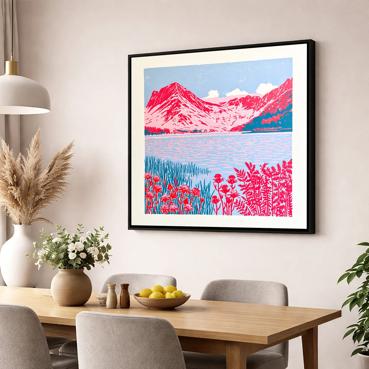 Bold Pink Fells of Buttermere lake district lake wall art displayed in a dining room