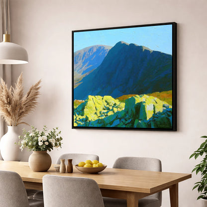 Sunlit Rocks on Great Carrs lake district fell wall art displayed in a dining room