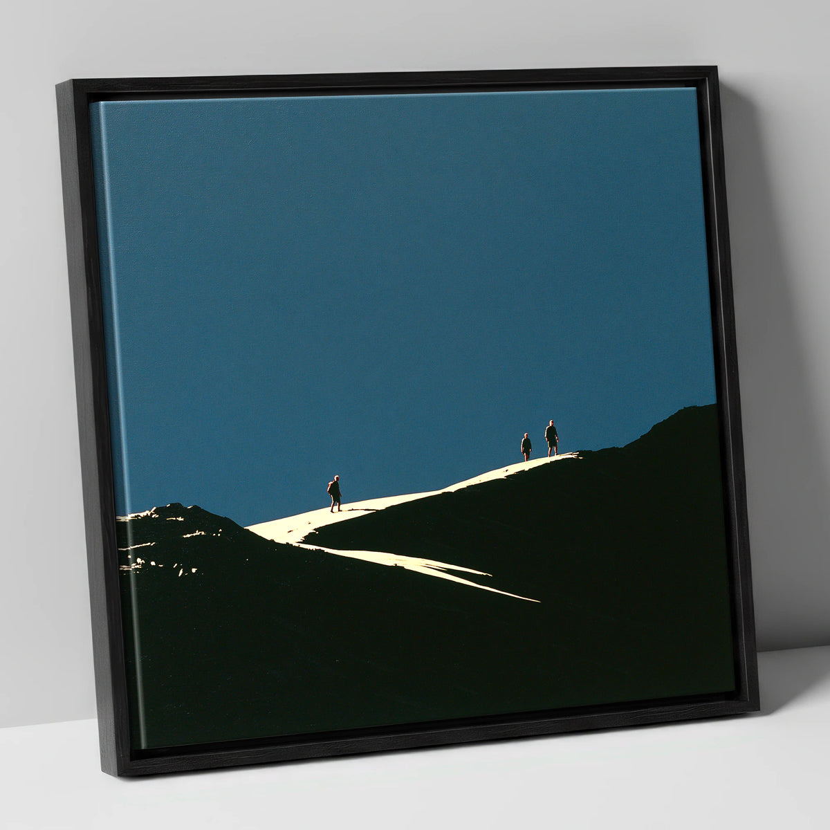 Hikers on a Sunlit Ridge lake district fell canvas wall art in black frame