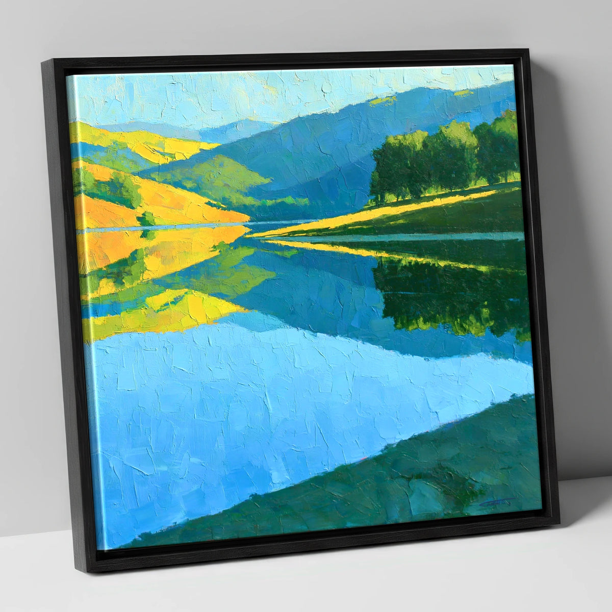 Sunlit Fells Mirrored in Blue Water lake district lake canvas wall art in black frame