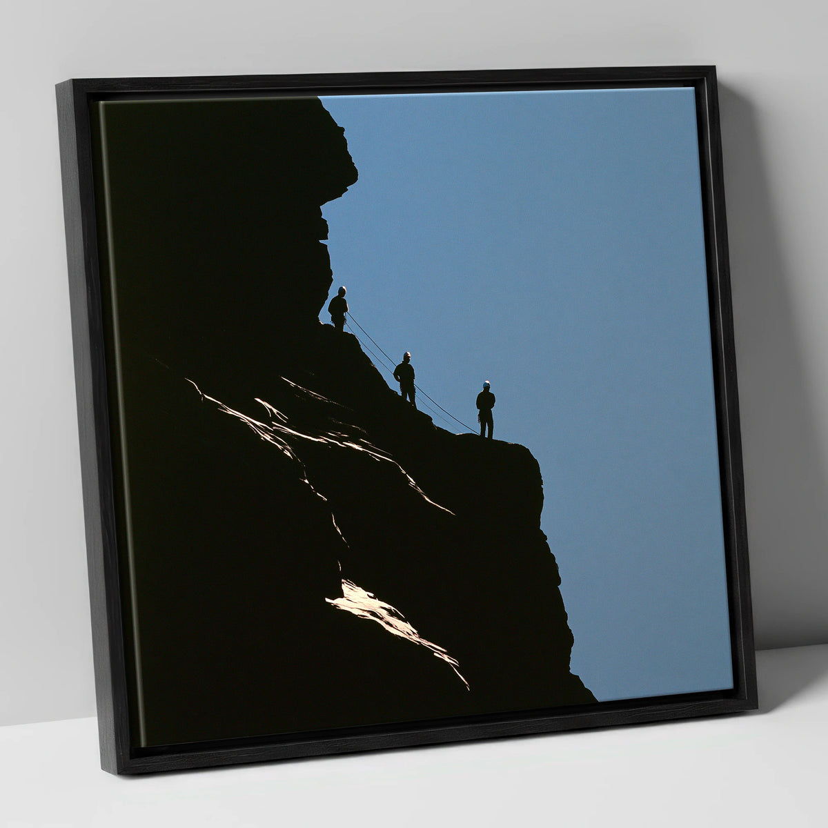 Silhouetted Climbers on a Crag lake district walking canvas wall art in black frame