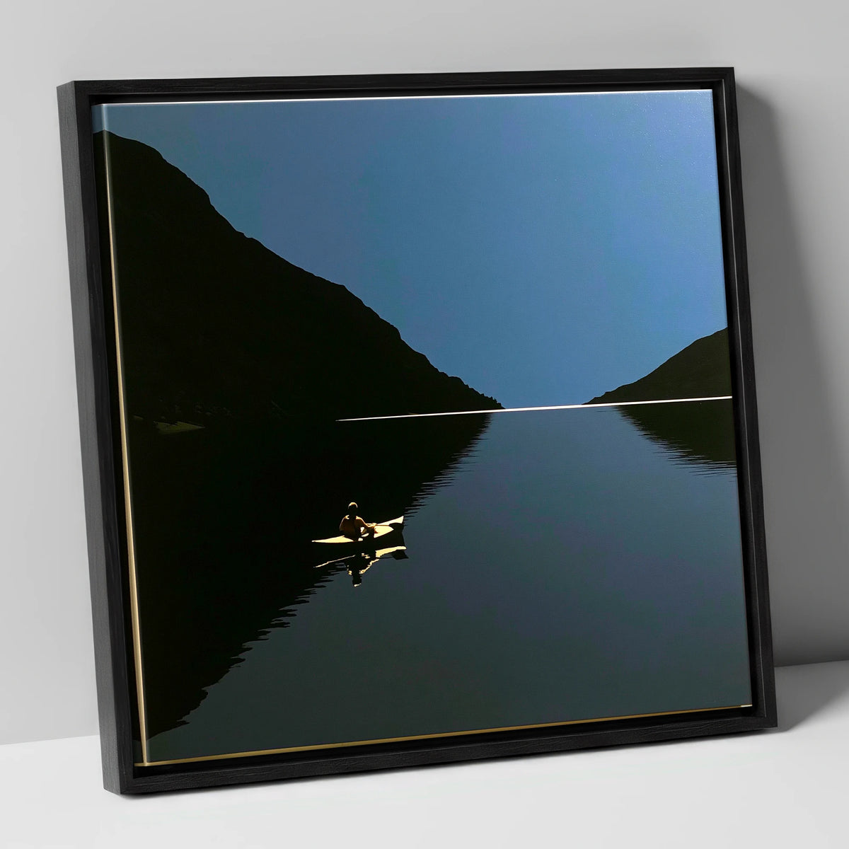 Illuminated Kayak on Dark Lake lake district walking canvas wall art in black frame