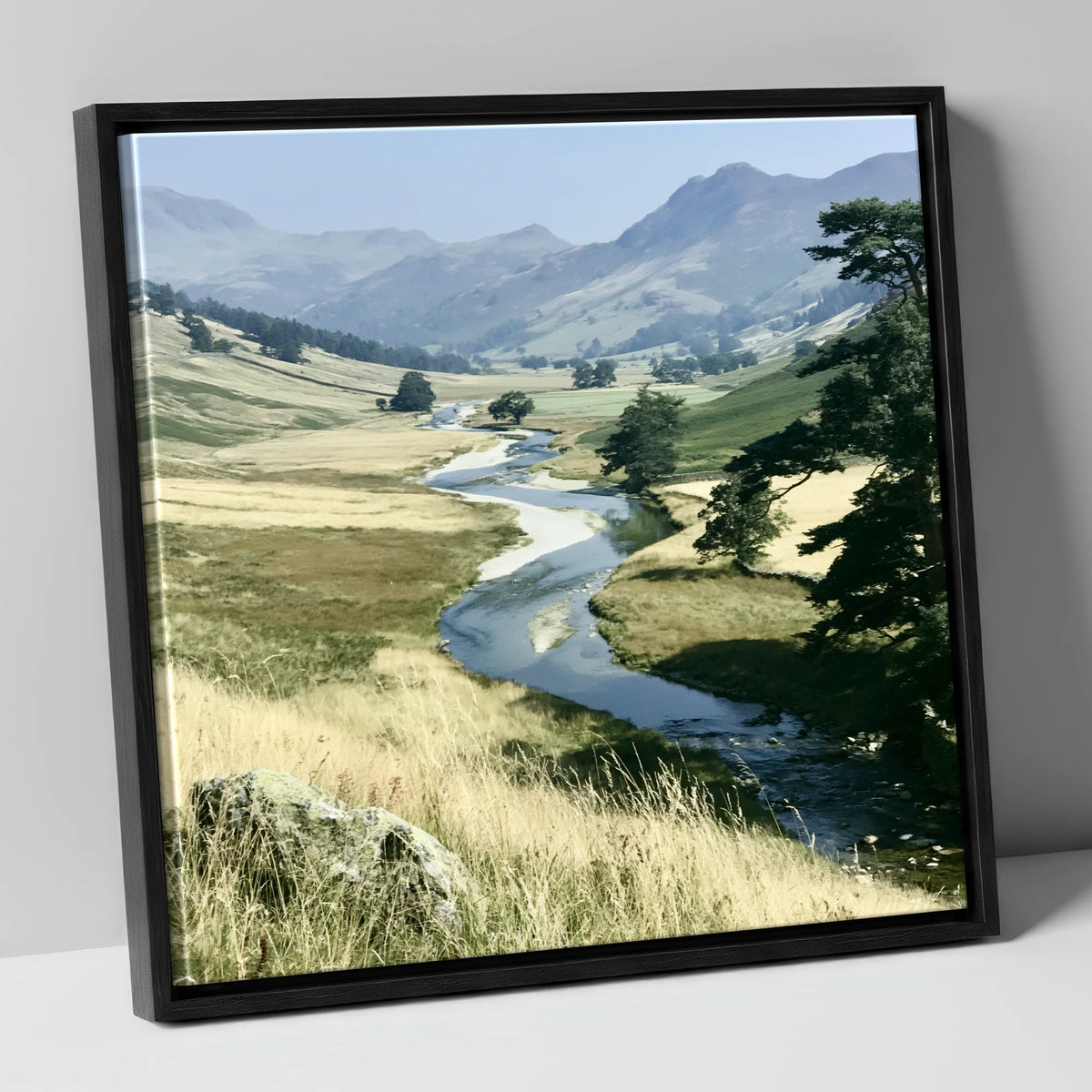 Winding River Beneath Hazy Fells lake district waterfall canvas wall art in black frame