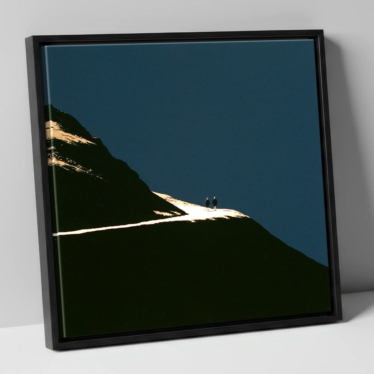 Fell Walkers On An Illuminated Path lake district walking canvas wall art in black frame