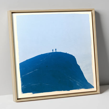 Hikers on a Blue Fell Top lake district fell canvas wall art in natural frame
