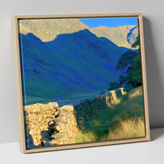 Sunlit Wall and Shadowed Fells lake district valley canvas wall art in natural frame