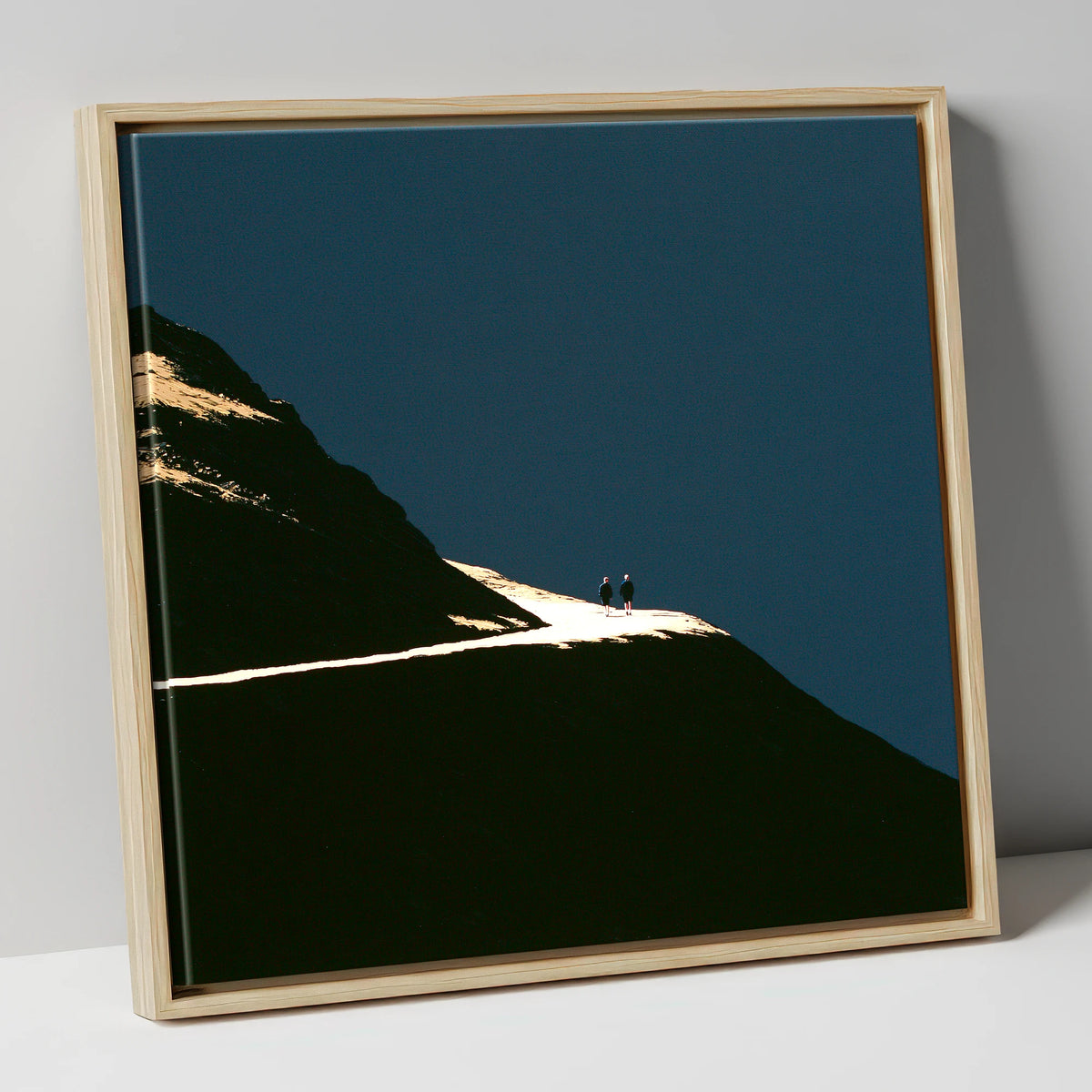 Fell Walkers On An Illuminated Path lake district walking canvas wall art in natural frame