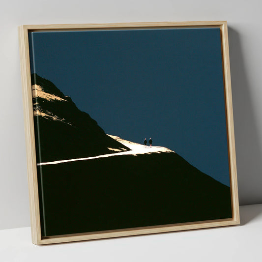 Fell Walkers On An Illuminated Path lake district walking canvas wall art in natural frame