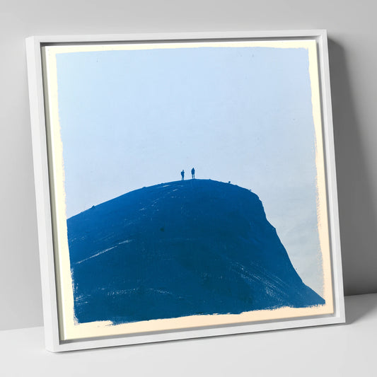 Hikers on a Blue Fell Top lake district fell canvas wall art in white frame