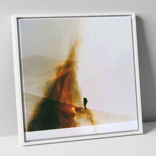 Fell-walker Silhouette in Amber Mist lake district walking canvas wall art in white frame