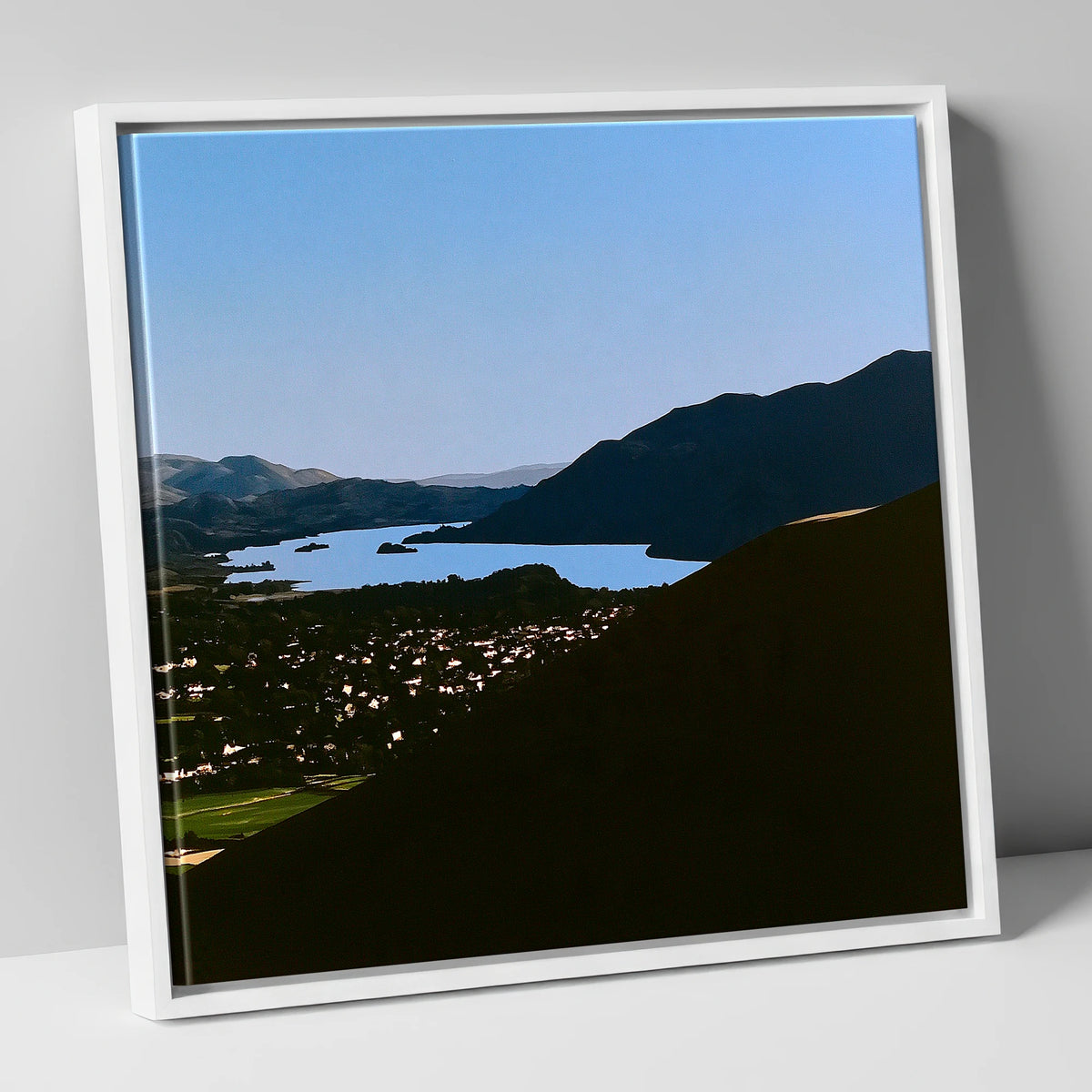 Keswick and Derwentwater in Silhouette lake district village canvas wall art in white frame