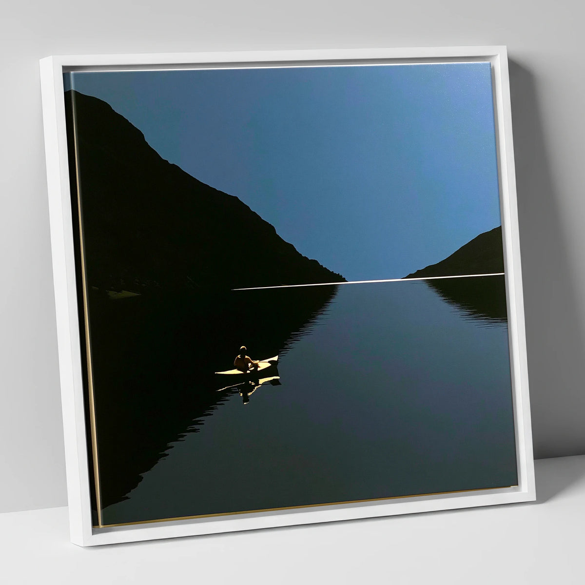 Illuminated Kayak on Dark Lake lake district walking canvas wall art in white frame