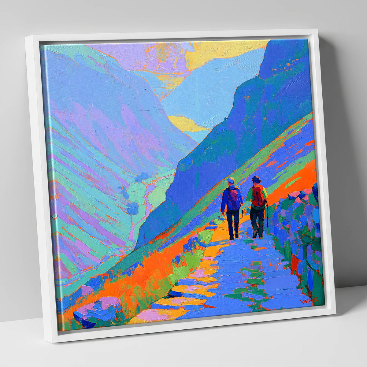 Walkers on a Colourful Mountain Path lake district walking canvas wall art in white frame