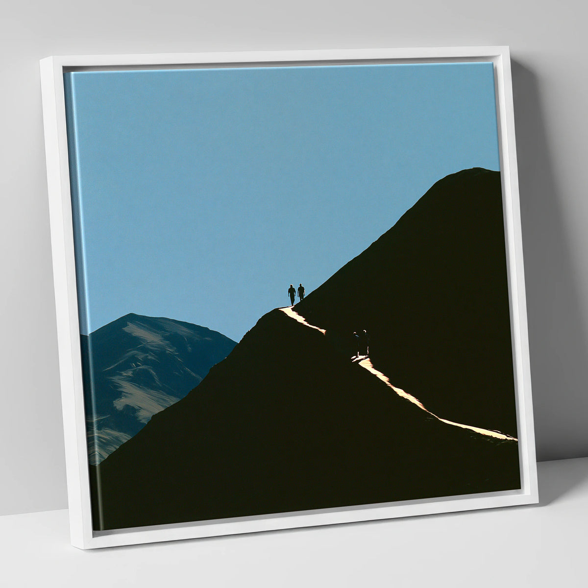 Walkers on a Sunlit Mountain Path lake district walking canvas wall art in white frame