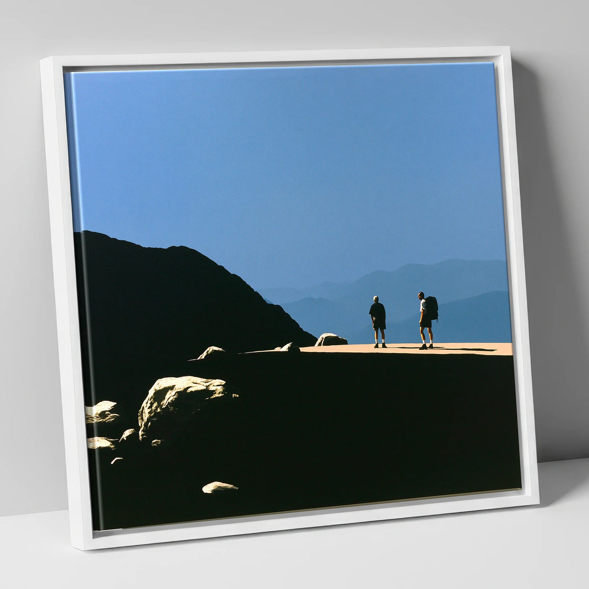 Hikers on a Sunlit Fell Ridge lake district fell canvas wall art in white frame