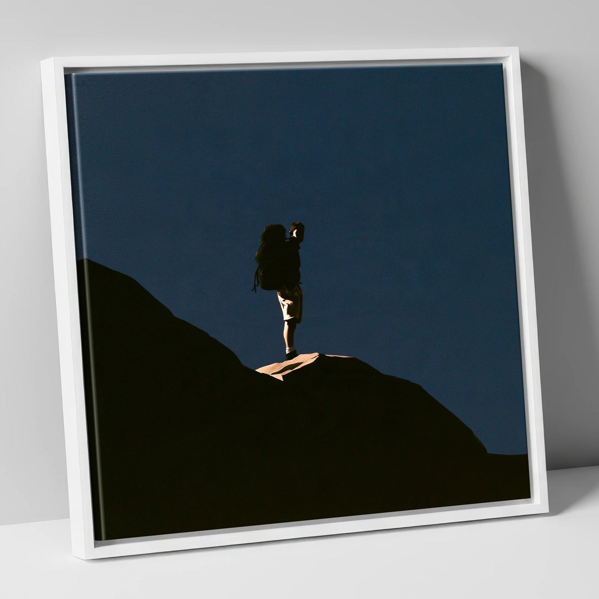 Hiker Silhouette on Dark Fell lake district walking canvas wall art in white frame