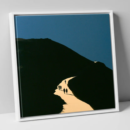 Walkers Ascending Luminous Fell Path lake district walking canvas wall art in white frame