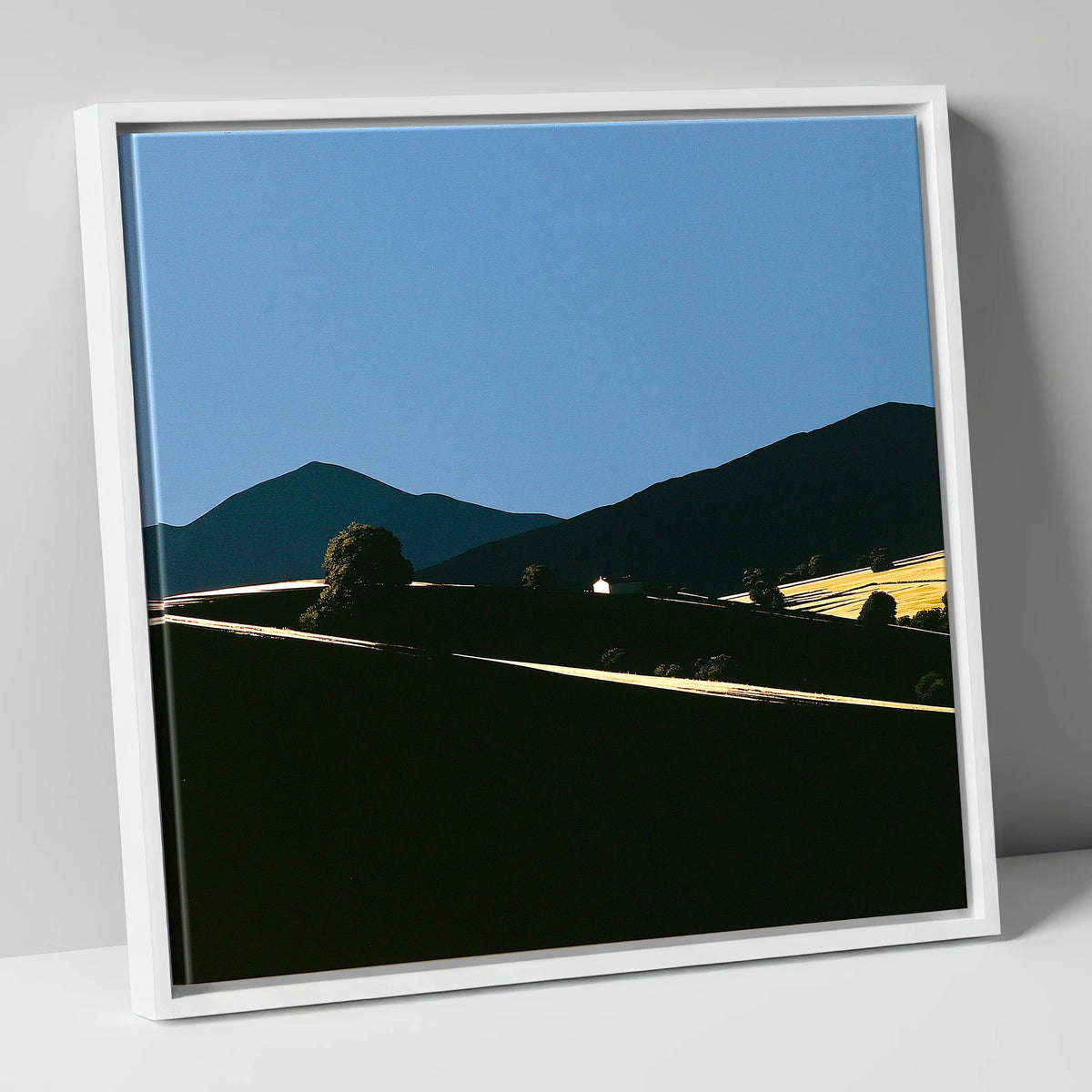 Golden Light on Silhouetted Fells lake district sky canvas wall art in white frame