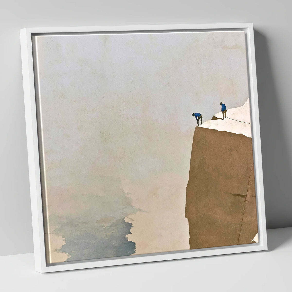 Climbers on a Snowy Crag lake district walking canvas wall art in white frame