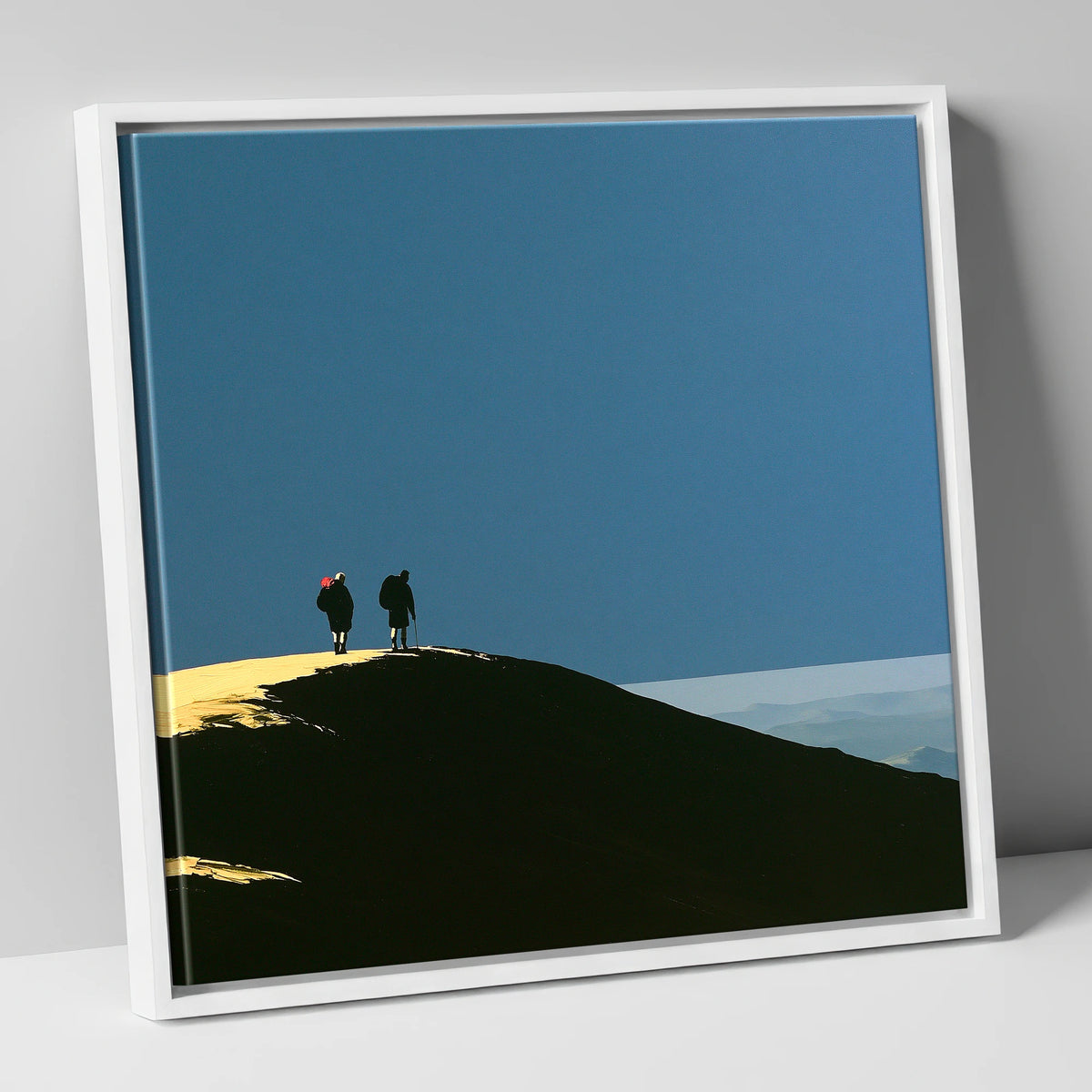 Silhouetted Hikers on a Fell Top lake district fell canvas wall art in white frame