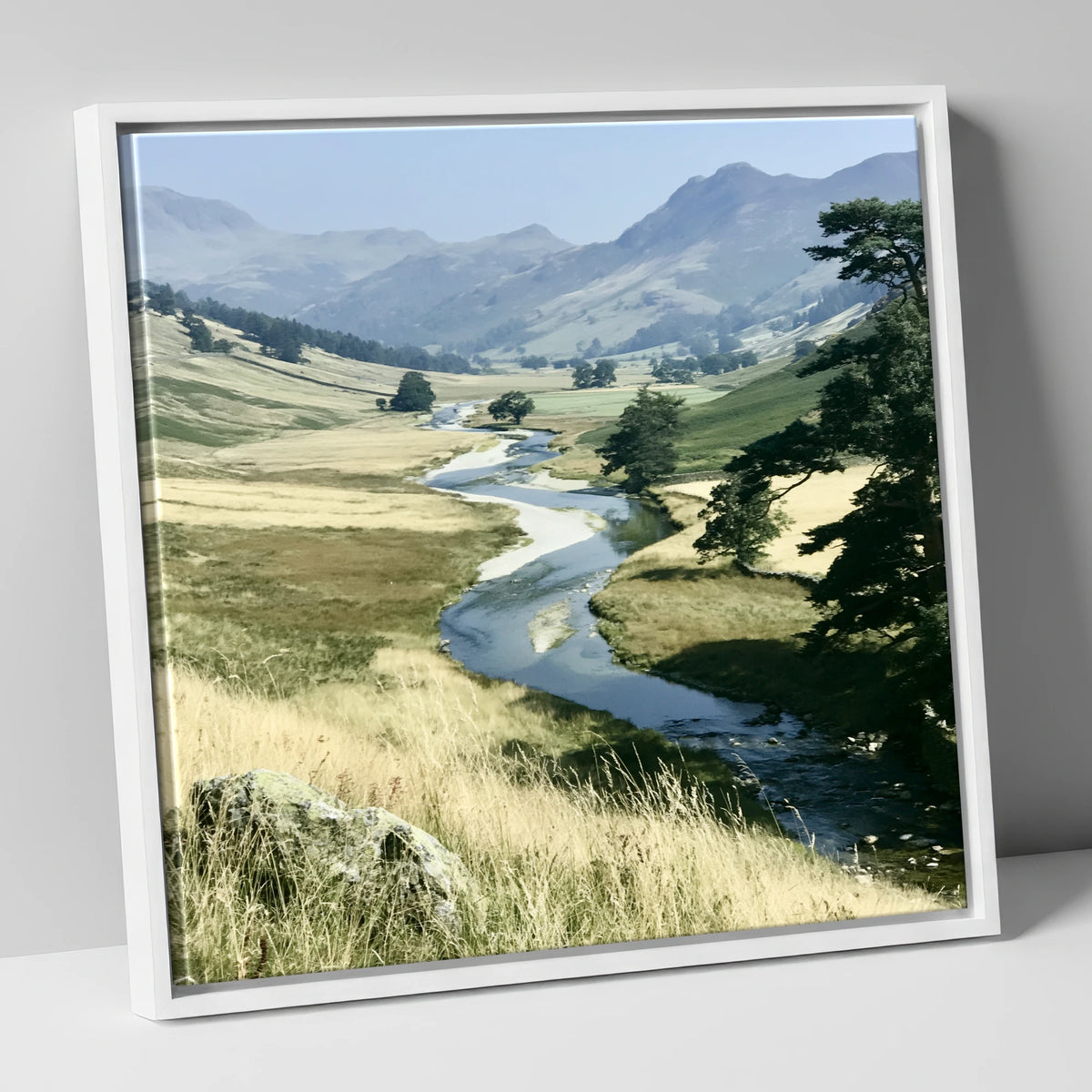 Winding River Beneath Hazy Fells lake district waterfall canvas wall art in white frame