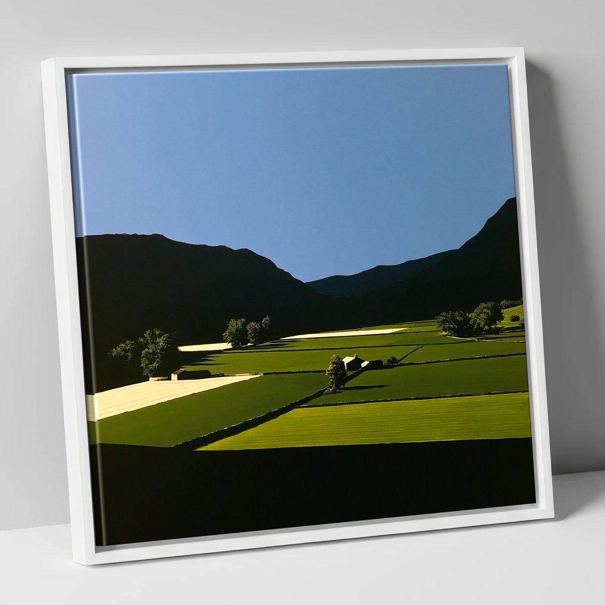 Sunlit Patchwork Fields in a Dale lake district valley canvas wall art in white frame