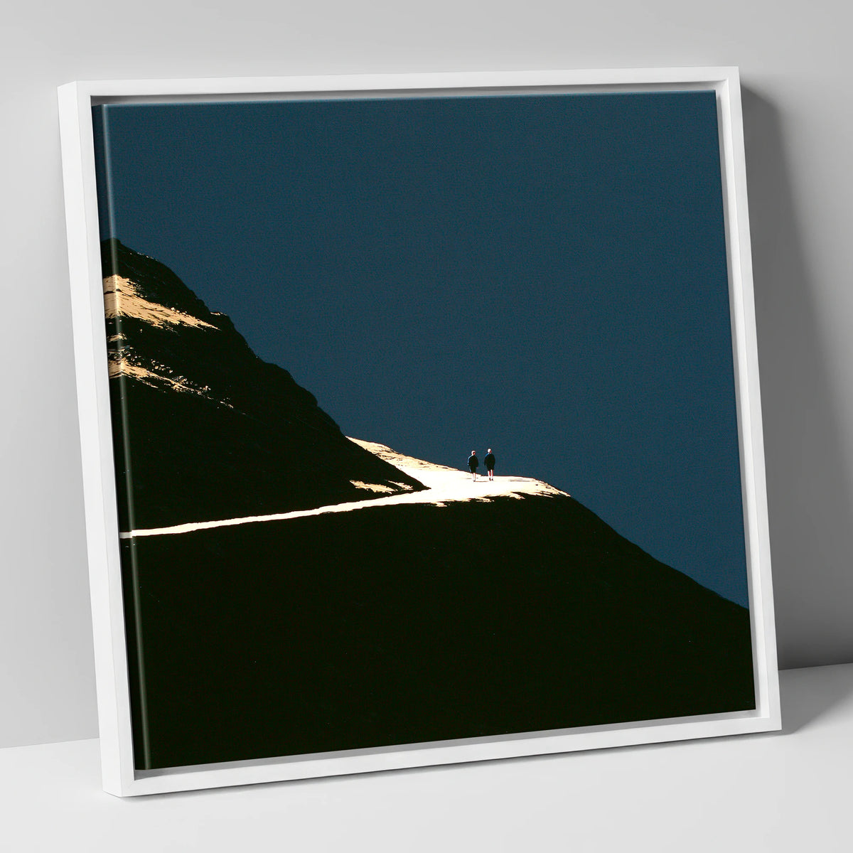 Fell Walkers On An Illuminated Path lake district walking canvas wall art in white frame
