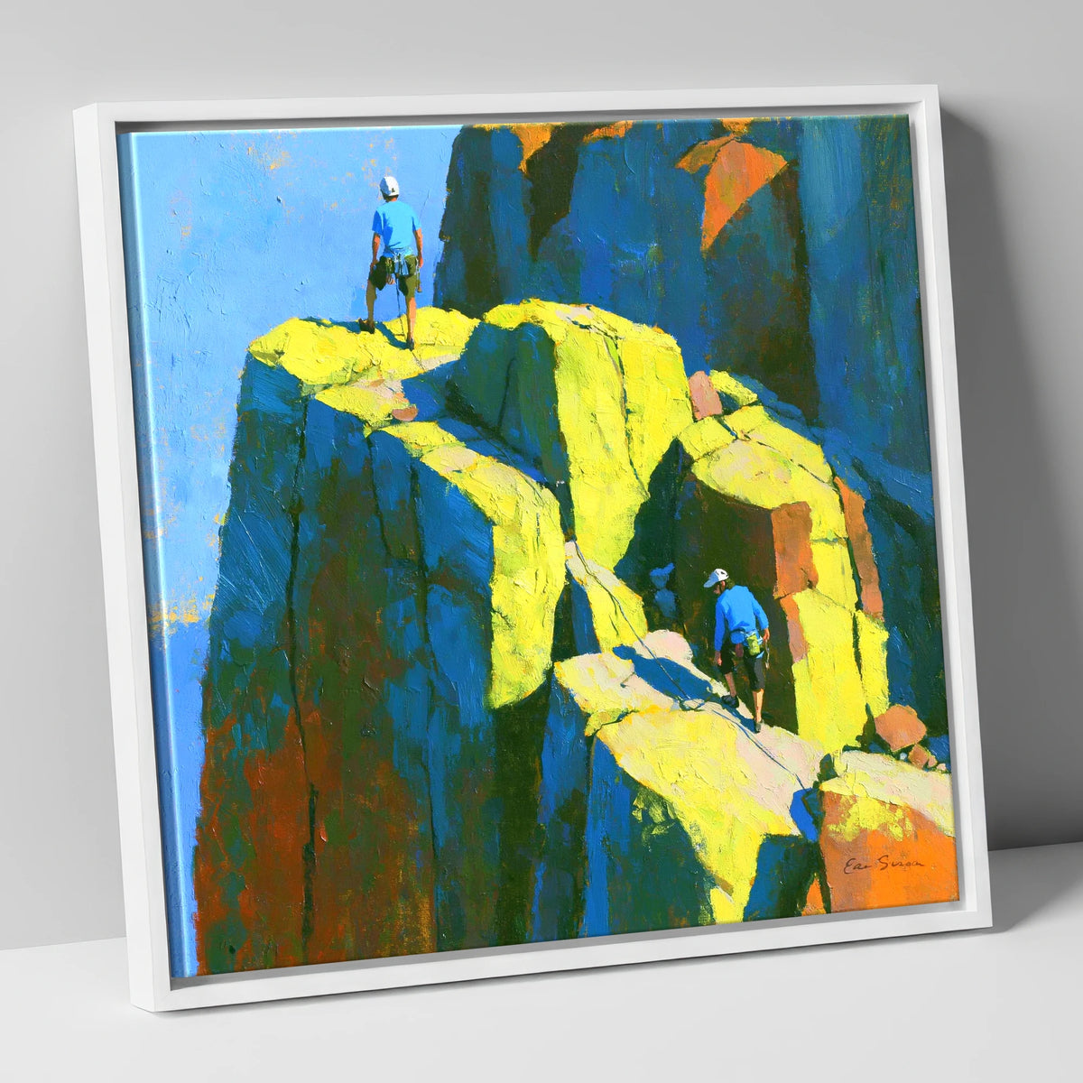 Mountaineers on a Sunlit Crag Pinnacle lake district walking canvas wall art in white frame
