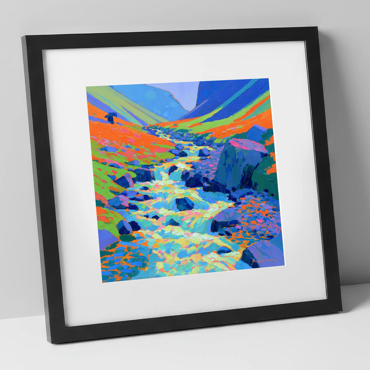 Vivid Flowing Fellside Beck lake district waterfall art print in black frame