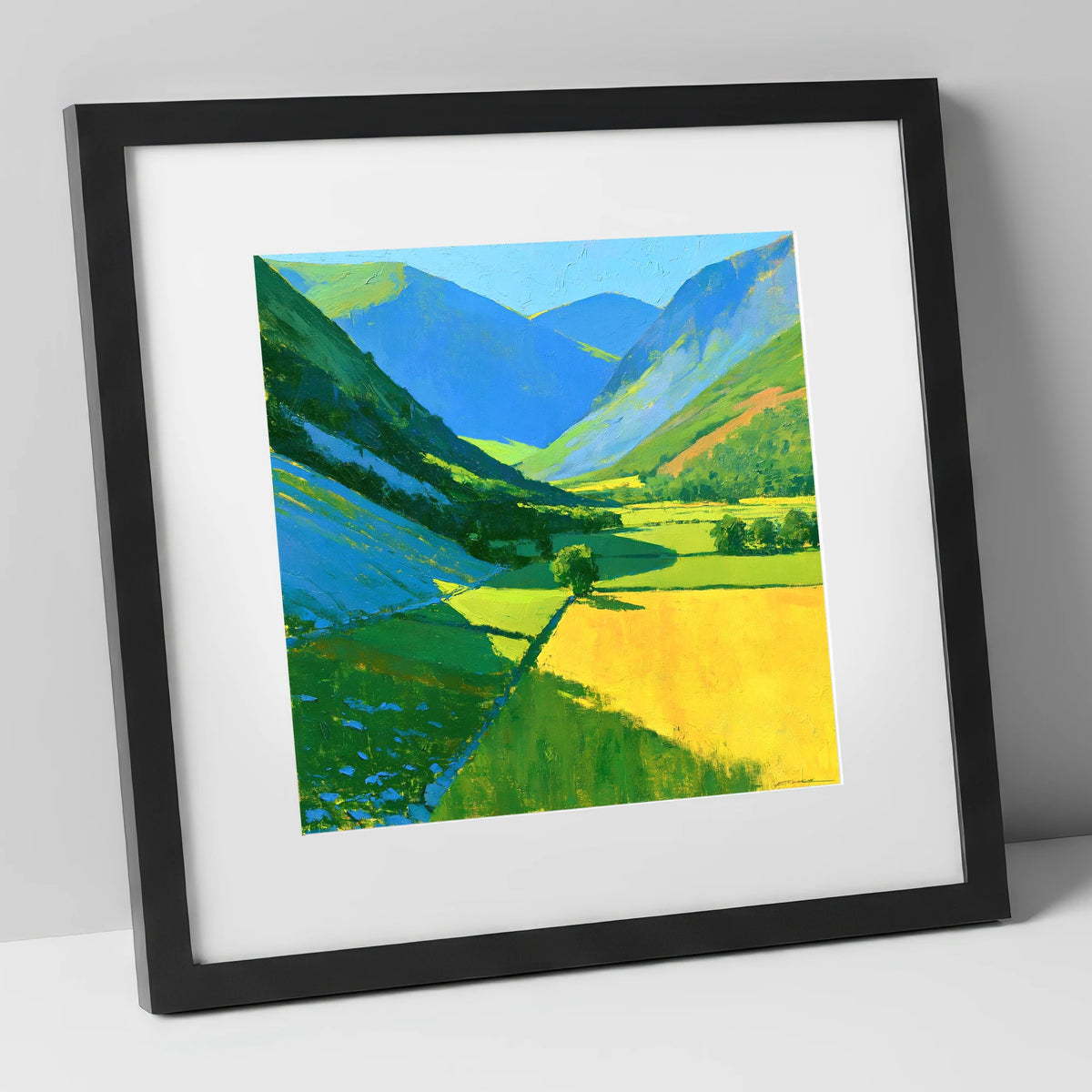 Vibrant Sunlit Valley with Blue Fellside Shadows lake district valley art print in black frame