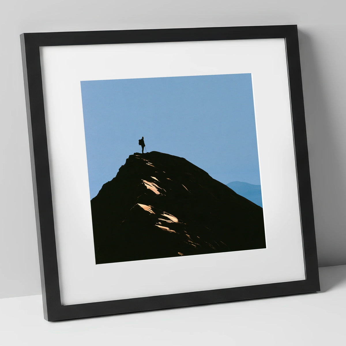 Walker Silhouette on Striding Edge lake district walking art print in black frame