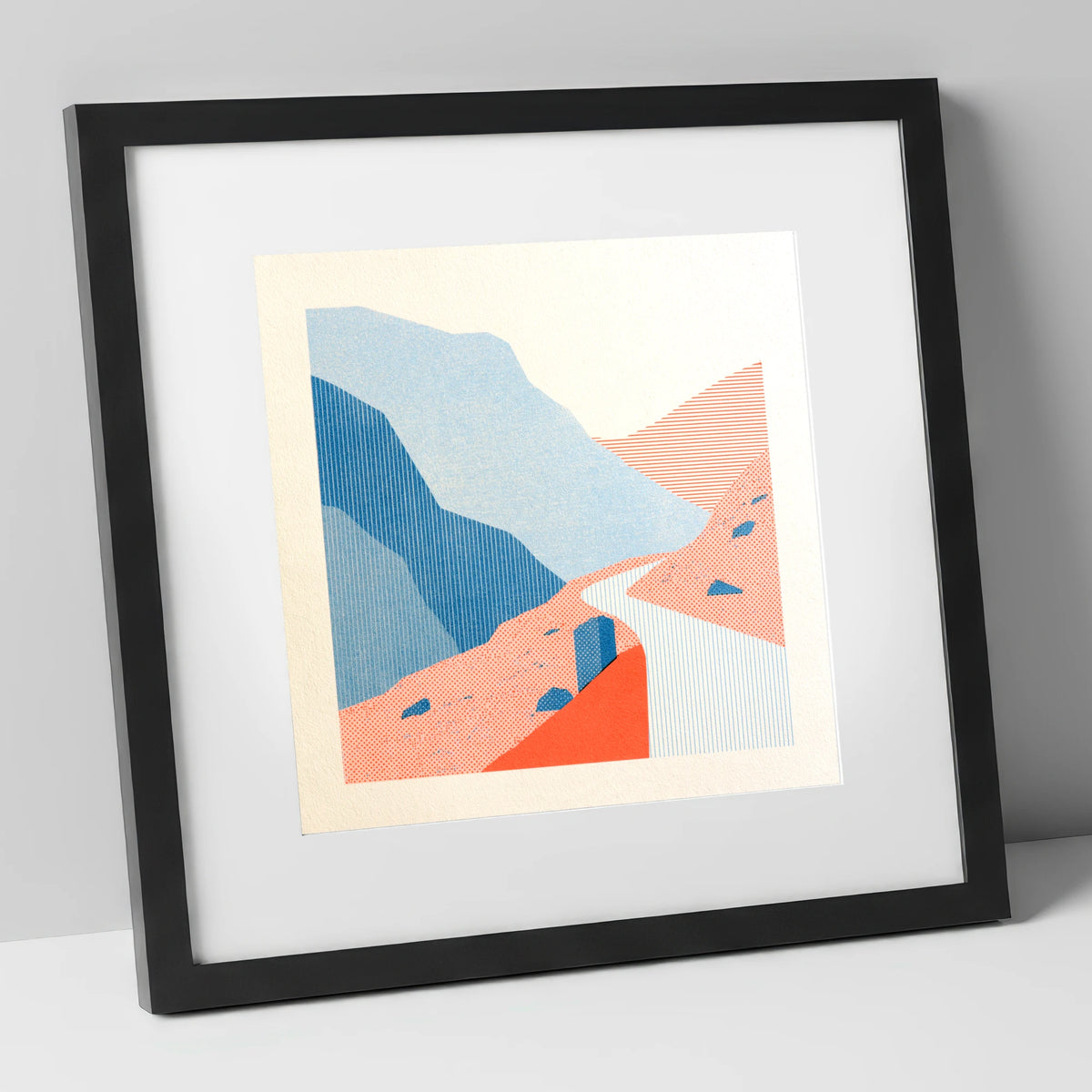 Hardknott Pass in Coral and Blue lake district valley art print in black frame
