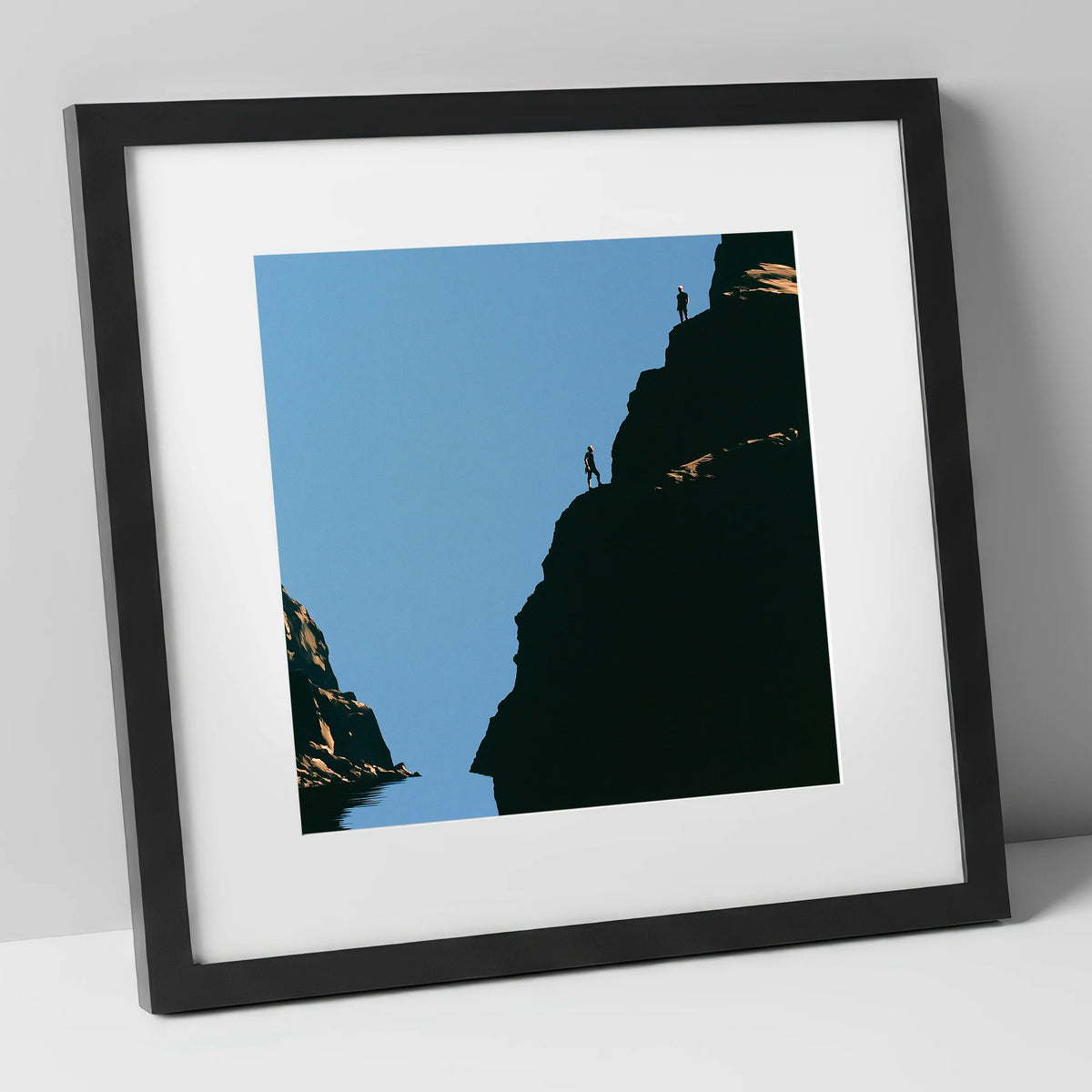 Silhouetted Climbers on Lakeland Crag lake district walking art print in black frame