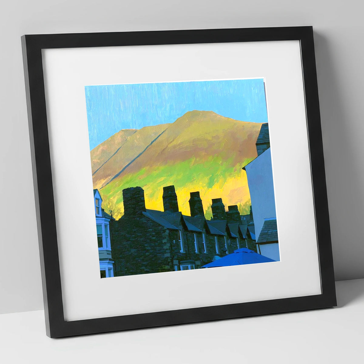 Keswick Chimneys and Sunlit Skiddaw lake district village art print in black frame