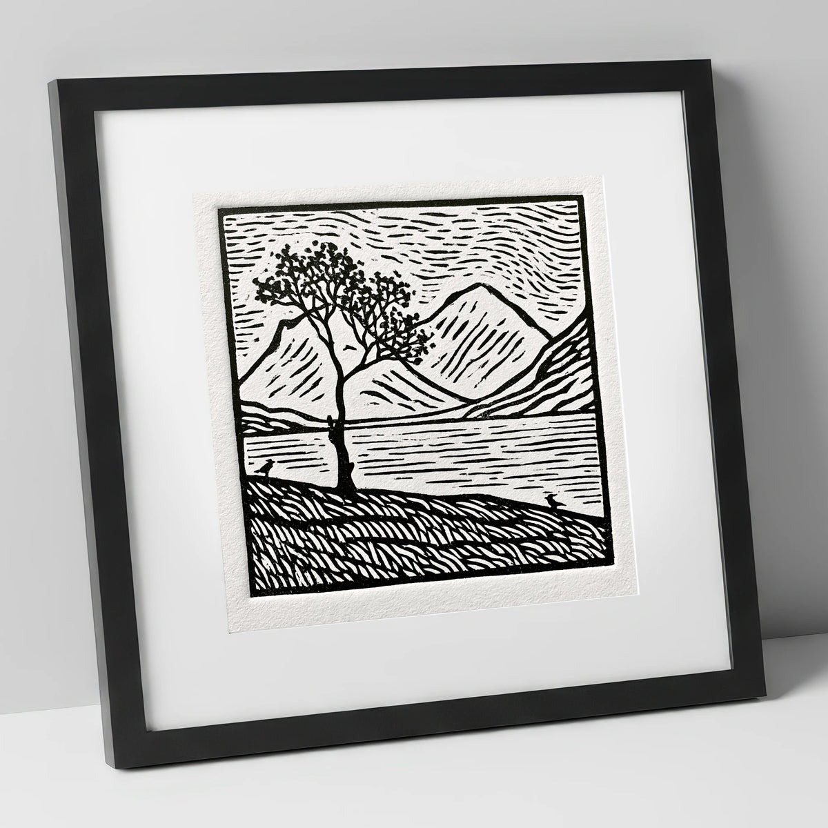 Monochrome Buttermere and Lone Tree lake district lake art print in black frame