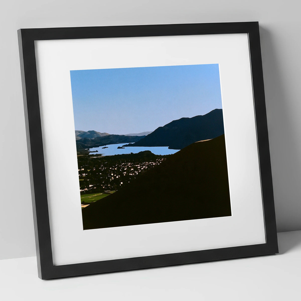 Keswick and Derwentwater in Silhouette lake district village art print in black frame