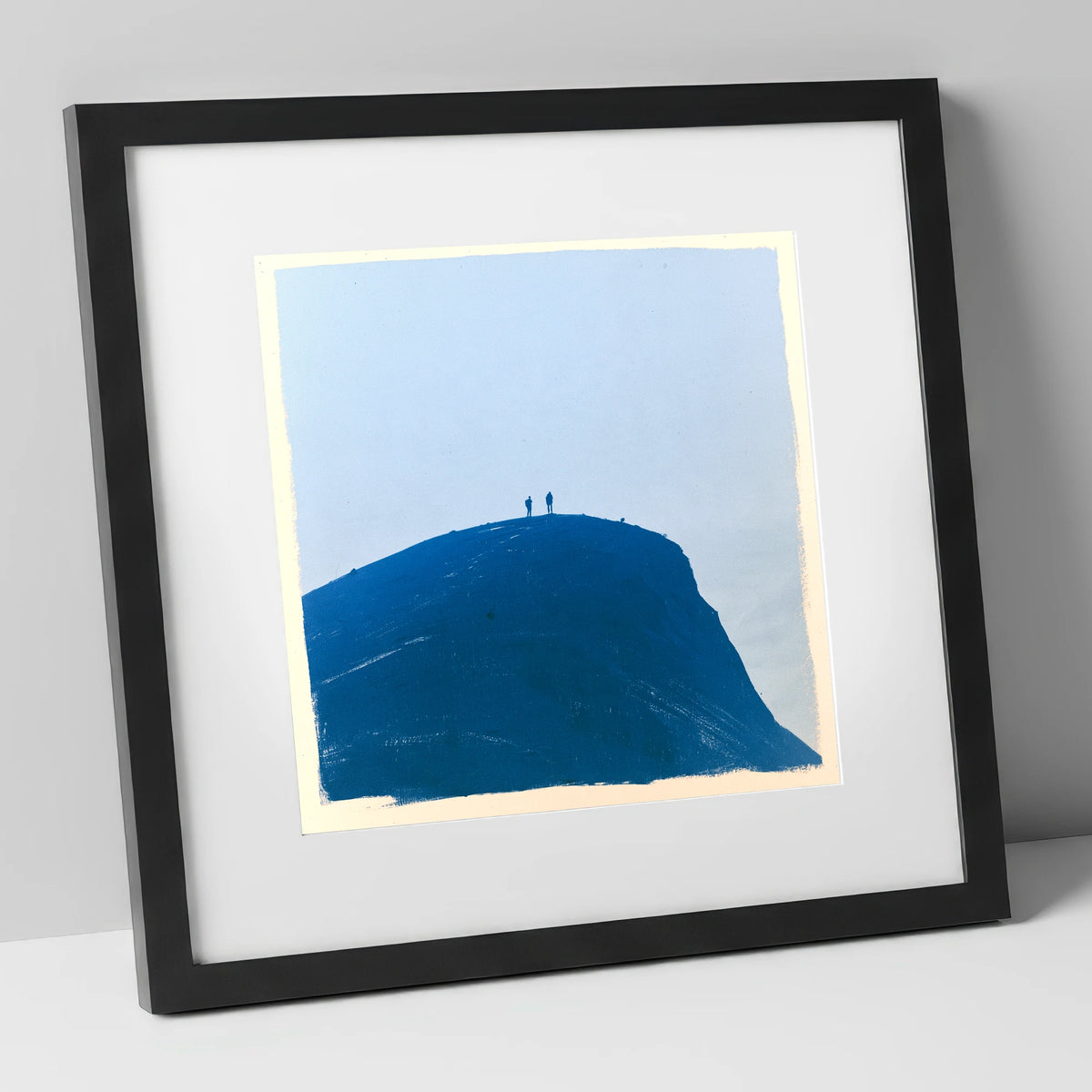 Hikers on a Blue Fell Top lake district fell art print in black frame