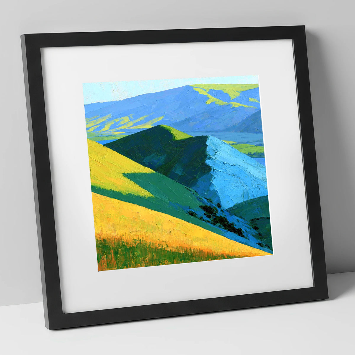 Vibrant Sunlit Fells and Deep Blue Shadows lake district sky art print in black frame