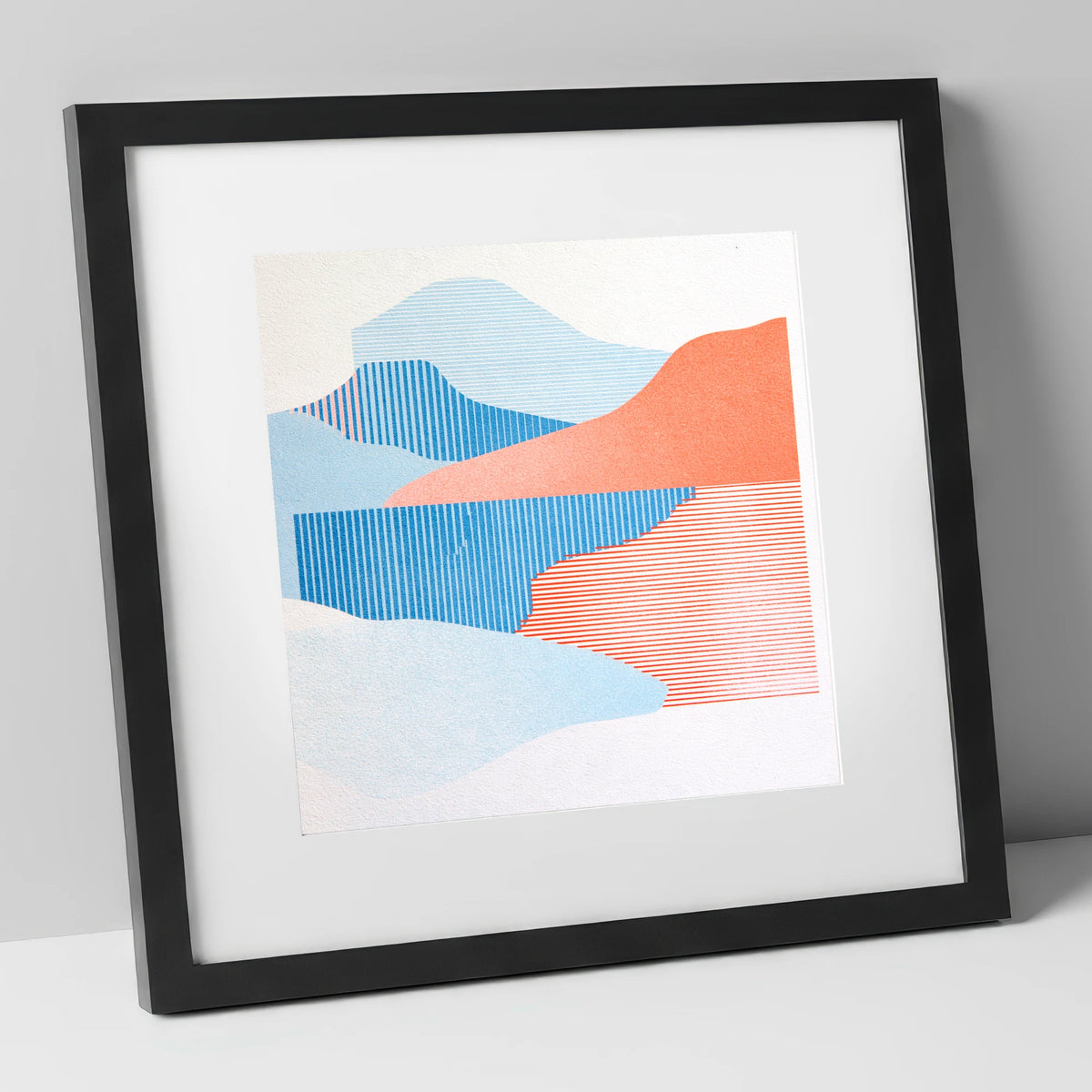 Graphic Lake Reflections In Coral lake district lake art print in black frame