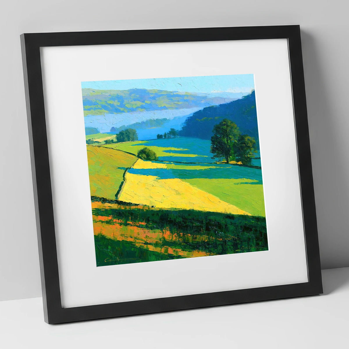 Sunlight and Shadow over Valley Fields lake district sky art print in black frame