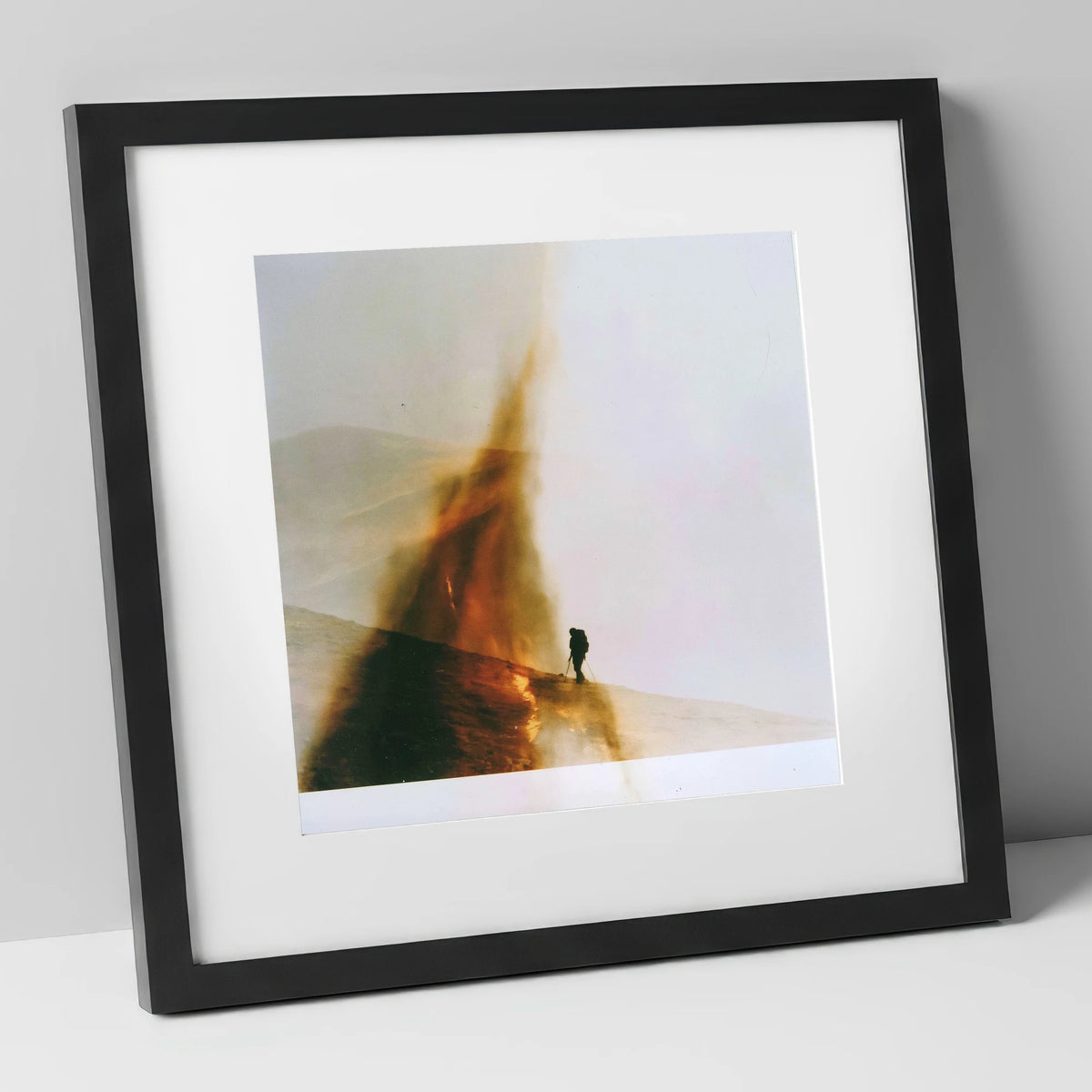Fell-walker Silhouette in Amber Mist lake district walking art print in black frame