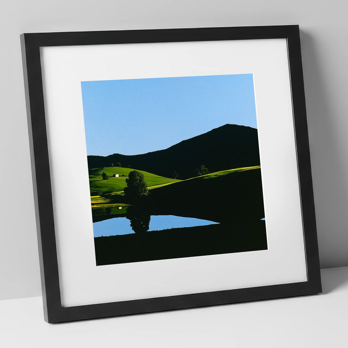Sunlit Fells and Shadowed Peak lake district sky art print in black frame