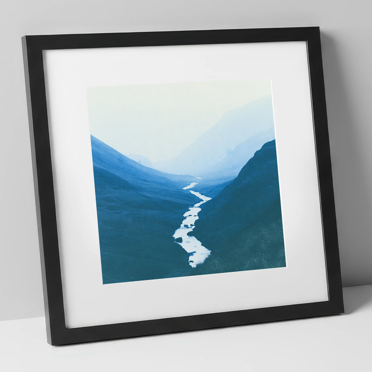 River Winding Through Blue Fells lake district waterfall art print in black frame