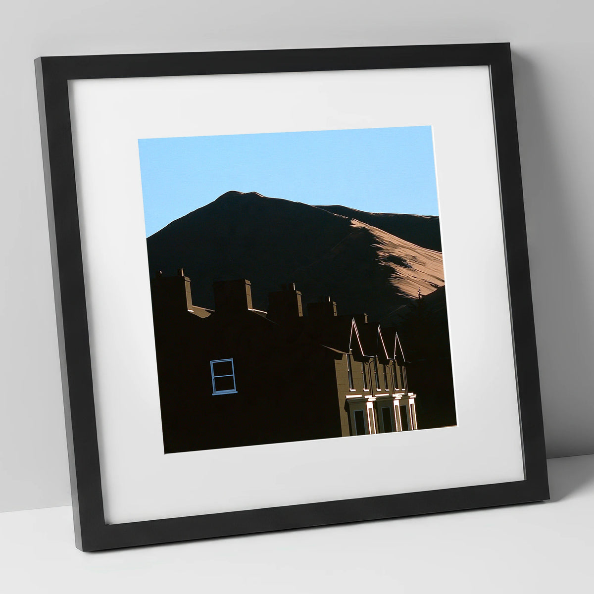 Silhouetted Keswick Terraces Beneath Skiddaw lake district village art print in black frame