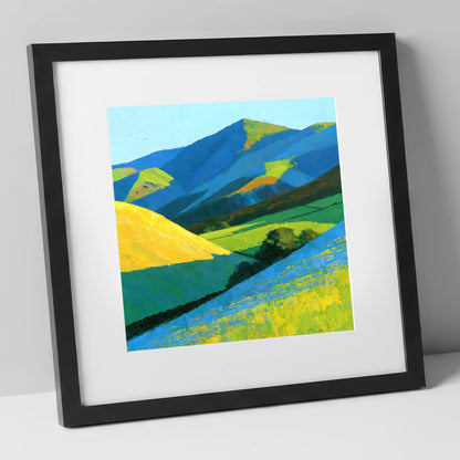 Vibrant Sunlight on Lakeland Fells lake district sky art print in black frame